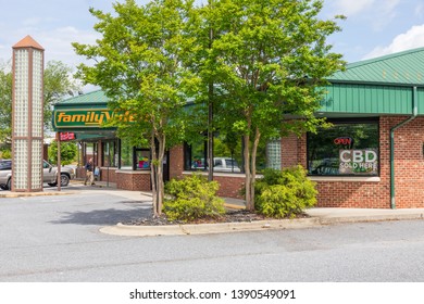 HICKORY, NC, USA-5/3/19: A Family Video Store, With Sign In Window Advertising CBD (cannabidiol) For Sale.