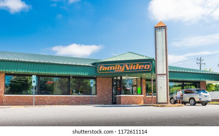 HICKORY, NC, USA-9/2/18: A Family Video Store, One In The Only Chain Of Video Stores In The U.S., With One Car And One Female In Parking Lot.