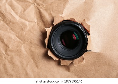 Hidden Camera Lens Through Hole In Paper. Space For Text