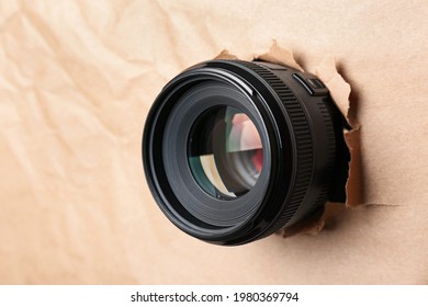 Hidden Camera Lens Through Hole In Paper, Closeup