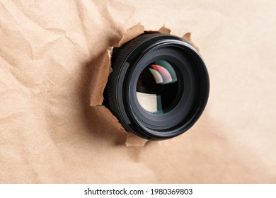 Hidden Camera Lens Through Hole In Paper, Closeup