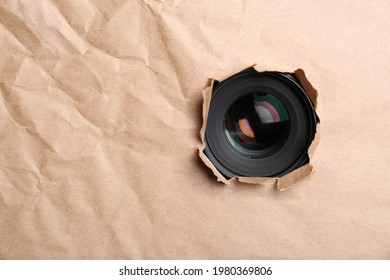 Hidden Camera Lens Through Hole In Paper. Space For Text