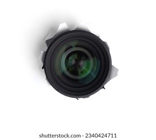 Hidden camera lens through hole in white paper,Concept of paparazzi or hidden camera