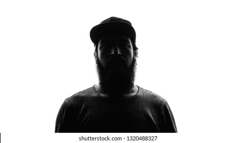 Hidden face in the shadow, bearded male person silhouette on white backrgound
