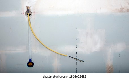 Hidden Installation Of Electrical Wires For Sockets To A Aged Concrete Wall
