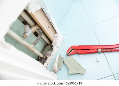 Hidden Leaks In Heating Or Watter Supply Can Cause Rot And Other Damage If Left Untreated. DIY, Plumbing, Water Leak, Home Repair Concept Photo.