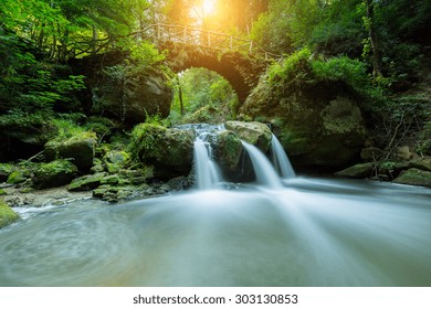 Hidden Mysteries waterfall in the forest - Powered by Shutterstock