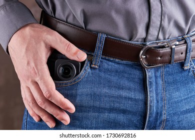 Hidden Photo Or Video Camera At Jeans Pocket. Harassment And Blog Concept.