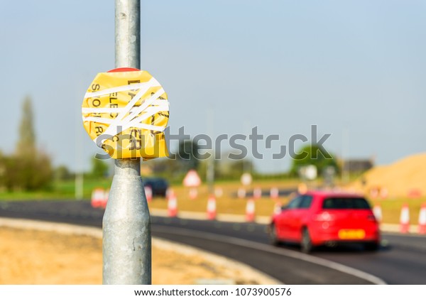 Hidden\
Speed Limit Road Roadworks sign on UK\
motorway