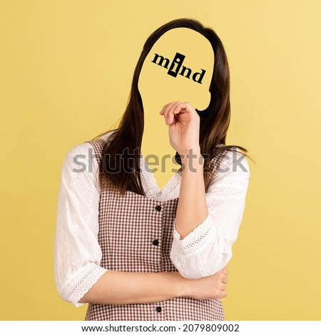 Hidden thoughts. Contemporary artwork. Portrait of faceless girl with word mind instead face isolated on yellow background. Human psychology, character traits, emotions, mental health concept.