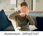 Hide and seek or peekaboo with boy on sofa in living room of home, playing games for fun or leisure. Cover eyes, emoji and hands on face of kid in apartment for child development or counting