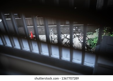 Hide And Seek Some Bicycle On The Balcony. Stalking Someone On The Street