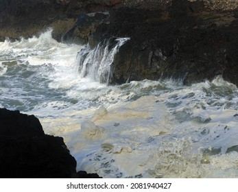 Hide tide waves foam in Devil's Churn, Cape Perpetua, Oregon coast
