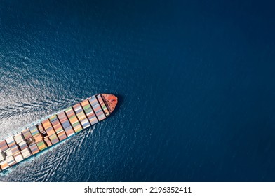 High aerial top down view of a large container cargo ship in motion over open ocean with copy space as a concept for import and export industry - Shutterstock ID 2196352411