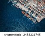 High aerial view of a commercial container terminal harbour with copy space