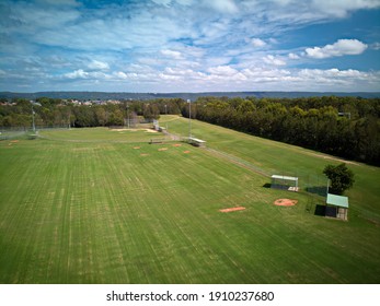 High Aerial View Of Green Grassed Sporting Fields, Baseball And Softball, Sunny Summer Day, No People, Surveyors Creek, Glenmore Park, NSW, Australia