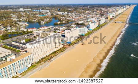 High aerial view of a long row of hotels along the Atlantic Ocean beach in Maryland USA