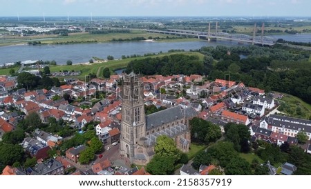 High altitude aerial bird view picture of the Saint Martin church in Zaltbommel is a municipality and a city in the Netherlands in the background showing Waal river a branch of river Rhine Stock photo © 