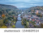 High altitude drone shoot over historic Victorian town at autumn. Ironbridge in Shropshire, UK