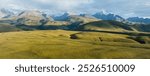 High altitude grassland and snow capped mountain in Sichuan, China