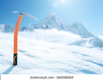 High altitude mountain climber's orange  ICE AXE. It  sticks out in the snow  on snow ice field with Ama Dablam (6812m) summit covered with clouds background.Extremal people vacations concept - Powered by Shutterstock