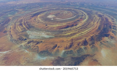 High altitude view of the Richat Structure is a prominent circular feature in the Sahara's Adrar Plateau near Ouadane west central Mauritania in Northwest Africa 4k screenshot of animation - Shutterstock ID 2019465713