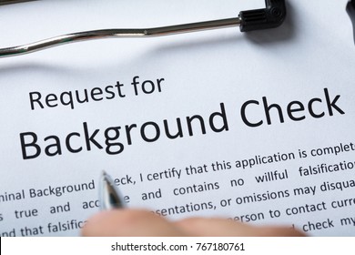 High Angel View Of Criminal Background Check Application Form With Pen
