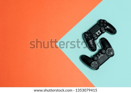 High angle above top view of two modern button joystick fog online video games isolated against colorful beautiful background