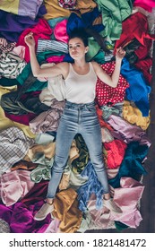 High angle above view photo of tired exhausted lady stay home general spring cleaning household lying many clothes hate mess heap stack floor pick select look outfit nothing to wear indoors