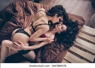 High Angle Above View Photo Of Two Tender Ladies Fit Shape Buttocks Lying Sheets On Top Lesbians Kissing Wish Want Intense Prelude Domination Red Black Bikini Boudoir Bedroom Indoors