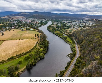 High Angle Aerial Drone View Of River Derwent, One Of The Major Rivers On The Island Of Tasmania, Australia, Near The Town Of New Norfolk, 30 Kilometres From Tasmanias Capital City Hobart.	
