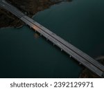 A high angle, aerial view of the Loop Parkway which crosses over the marshlands in Baldwin Bay. Taken during a cloudy sunset in autumn, near Freeport, New York.