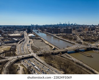 A high angle, aerial view of the McCombs Dam Bridge crossing the Harlem River in New York. Taken on a sunny day with a drone camera.