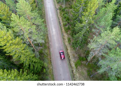 High Angle Aerial View Of Read Car On Forest Road