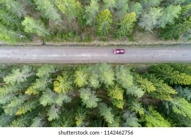 High Angle Aerial View Of Read Car On Forest Road