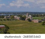 A high angle aerial view of Saint George School in Middletown, Rhode Island on a sunny day with blue skies and white clouds.