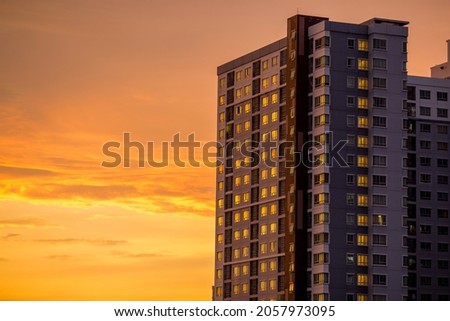 The high angle background of the city view with the secret light of the evening, blurring of night lights, showing the distribution of condominiums, dense homes in the capital community