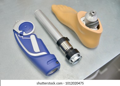 High Angle Background Of Disassembled Prosthetic Leg And Foot On Table In Orthopedic Equipment Shop, Disability Concept