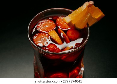 High Angle Close Up of Red Fruit Sangria Garnish with Fresh Strawberry Slices