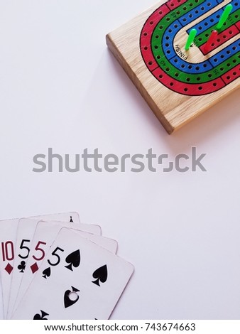 High Angle of Cribbage Board and Winning Hand on Whitebackround