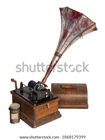High angle cut out of 19th century American old phonograph with one cylinder record, including clipping path, isolated on white