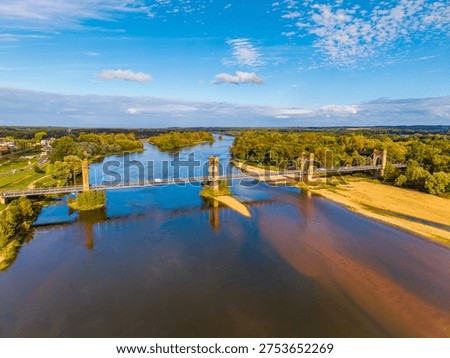 High angle Drone Point of View on the Langeais Bridge, a suspension bridge located in the Indre-et-Loire department and the Centre-Val de Loire region in Western France. The Bridge dates from 1849 and crosses the Loire River between Langeais and La Chapelle-aux-Naux.