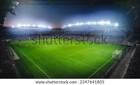 High Angle Establishing Shot: Stadium with Soccer Championship Match. Teams Play, Crowds of Fans Cheer. Football Cup Tournament. Sport Channel Television Concept, Screen Content. Wide Shot.