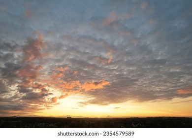 High Angle Footage of Most Beautiful and Colourful Sky with Orange and Purple Clouds over British City of England UK. Luton, England Great Britain, UK. Footage Was Captured on August 8th, 2023 - Powered by Shutterstock