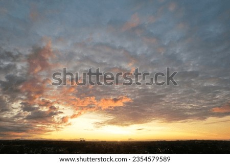 High Angle Footage of Most Beautiful and Colourful Sky with Orange and Purple Clouds over British City of England UK. Luton, England Great Britain, UK. Footage Was Captured on August 8th, 2023