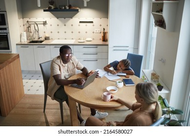 High Angle Home Scene Of Modern Multiethnic Family At Dinner Table In Kitchen, Copy Space