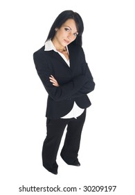High angle isolated studio shot of a businesswoman looking up at the camera with her arms crossed.