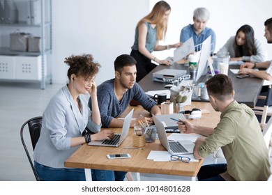 High angle of multicultural team working together in the corporation office