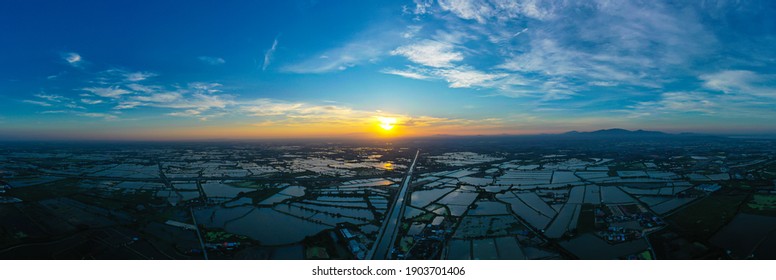 High Angle Panorama View Of Sunset Scene Over White Shrimp (prawn )farm, Fish Farm, Important Aquaculture Area In South East Asia And Electricity Authority Station, Thermal Power Plant By The River.