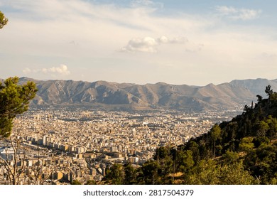 High angle panoramic view of Palermo city cityscape surrounded by majestic mountains, Sicily, Italy.